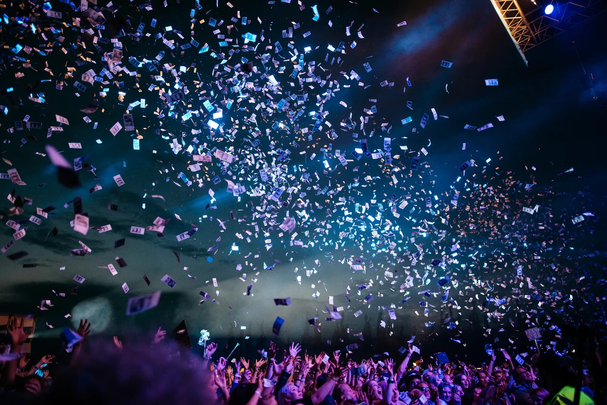“Confetti flying over the attendees of a concert at Dockville Festival” by Pablo Heimplatz on Unsplash